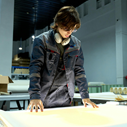 Man examines blueprint in warehouse