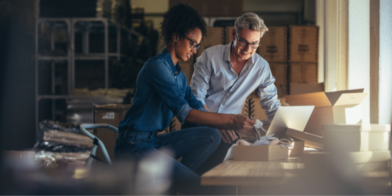 A male and female business owner discuss their IP enforcment options in their studio