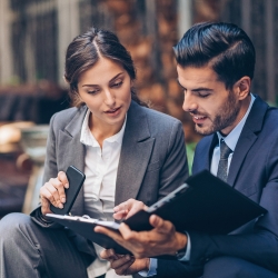 Man and woman looking at documents