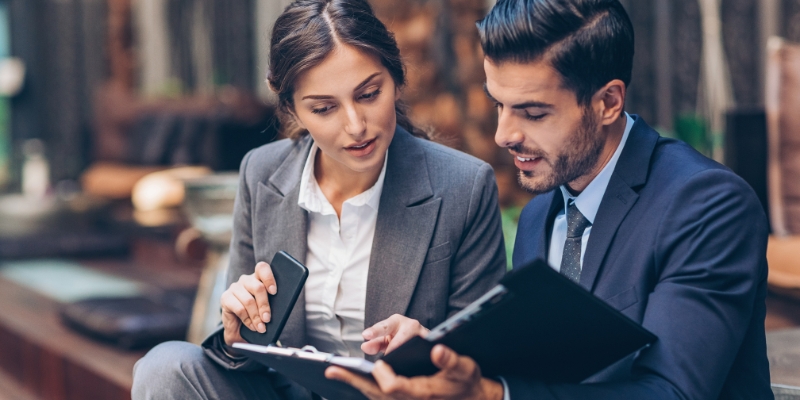 Man and woman looking at documents