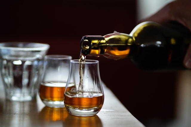 Whisky being poured into a glass.